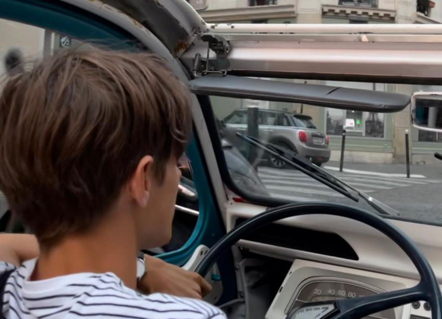 Guided Tour of Paris in Citroën 2CV - Meet the driver-guide vibe: Pierre, music, and storytelling