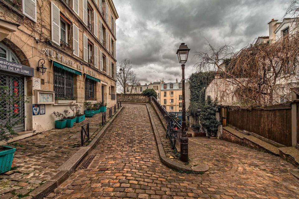 Montmartre Walking Tour in English - Meeting on Montmartre’s timeline: Metro Blanche and the yellow umbrella