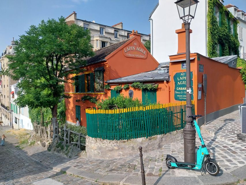 Montmatre Walking Tour: the essential highlights+ - Moulin de la Galette: The Windmill That Feels Like a Theme Song
