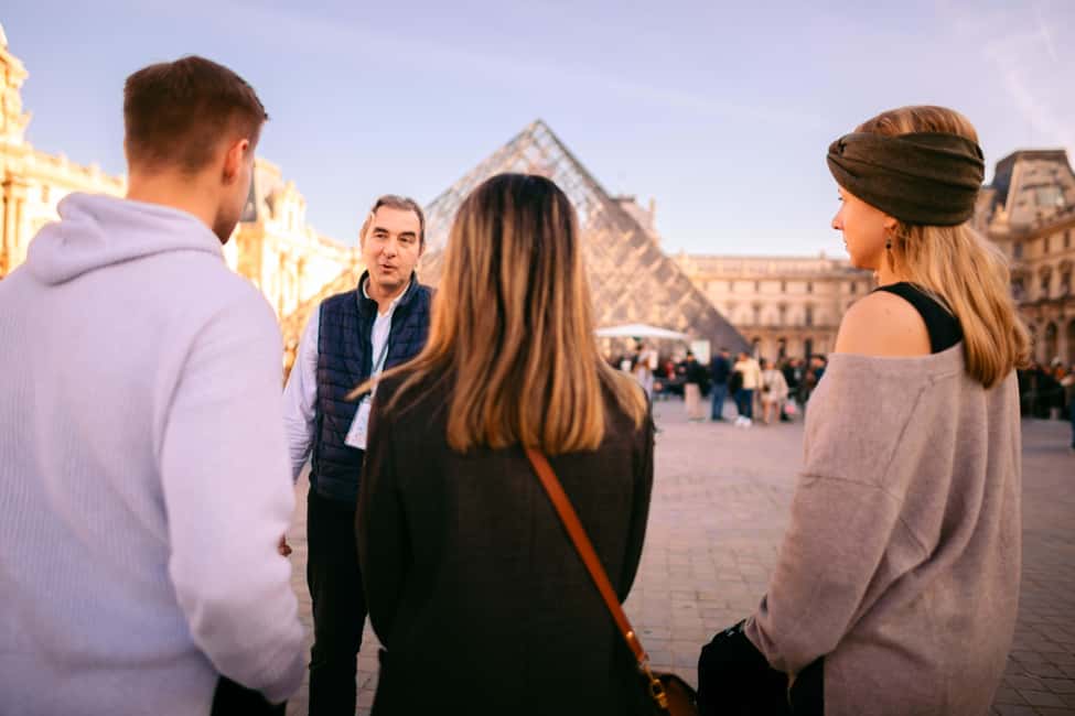 Paris Louvre Exclusive Semi Private Guided Tour Max 6 People - Louvre Pyramid Pass-By: A Quick Orientation Moment