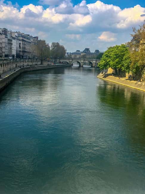 Paris: Notre Dame Exteriors and Ile de la Cité Walking Tour - Place Dauphine: the calm square that resets your pace