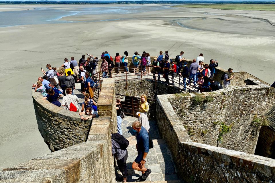 Private Mont Saint-Michel trip from Paris Calvados tasting - Entering Mont Saint-Michel with a guided Abbey plan